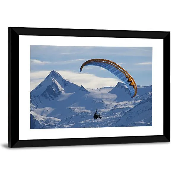 Paragliding Over Mountain In Winter Canvas Wall Art