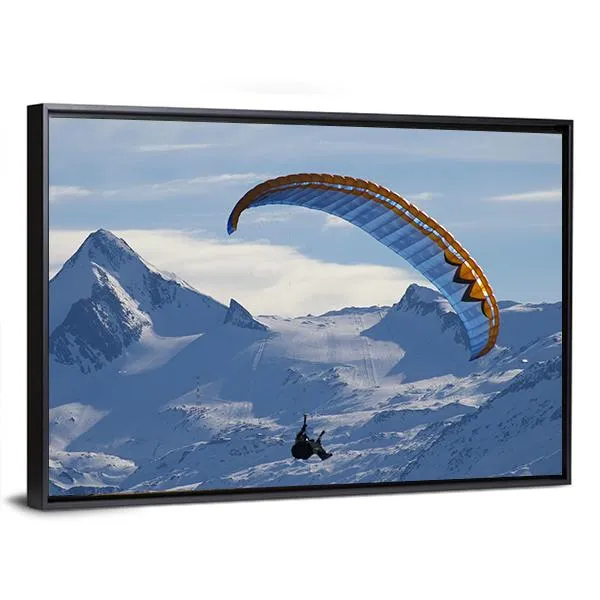 Paragliding Over Mountain In Winter Canvas Wall Art