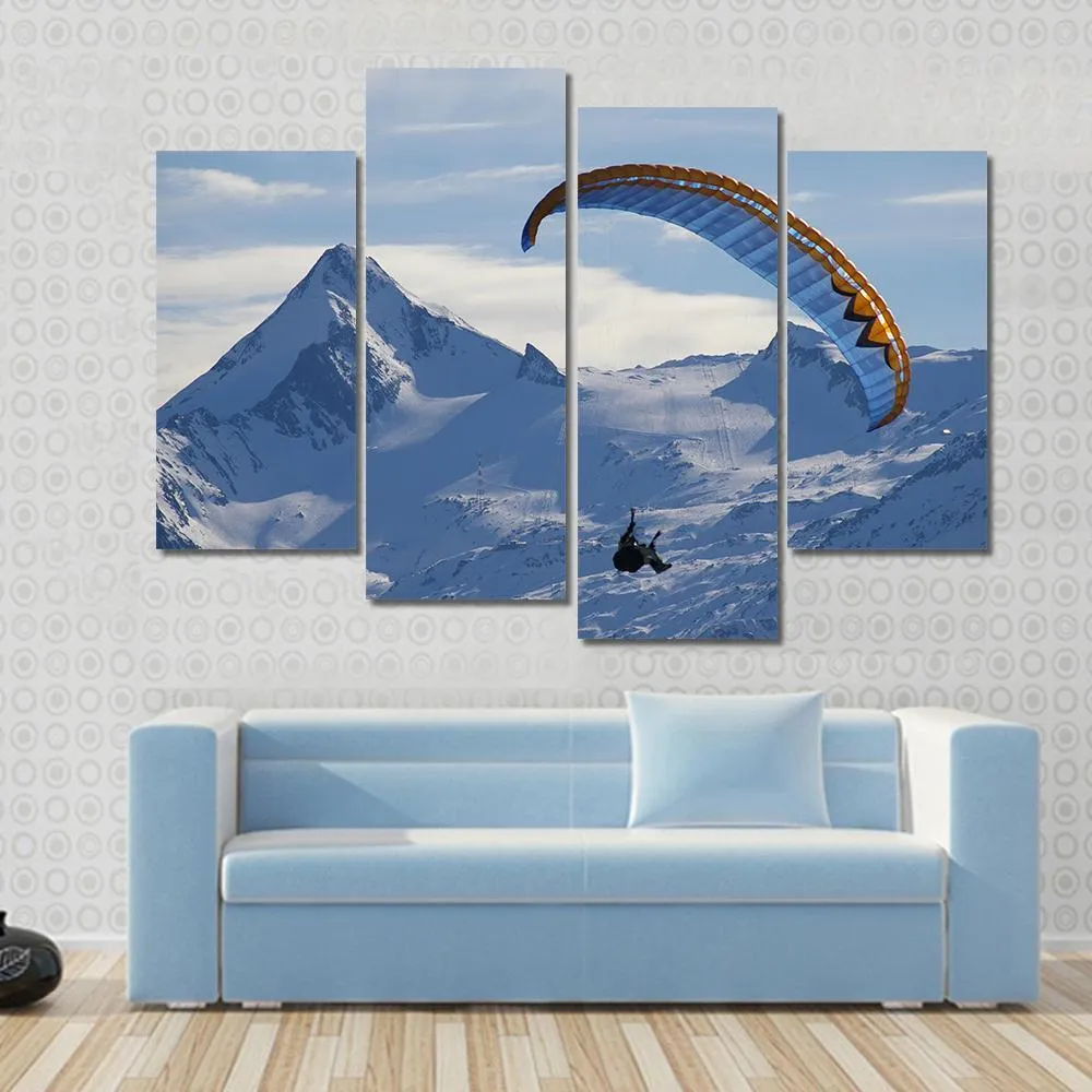 Paragliding Over Mountain In Winter Canvas Wall Art