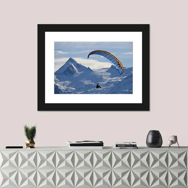 Paragliding Over Mountain In Winter Canvas Wall Art