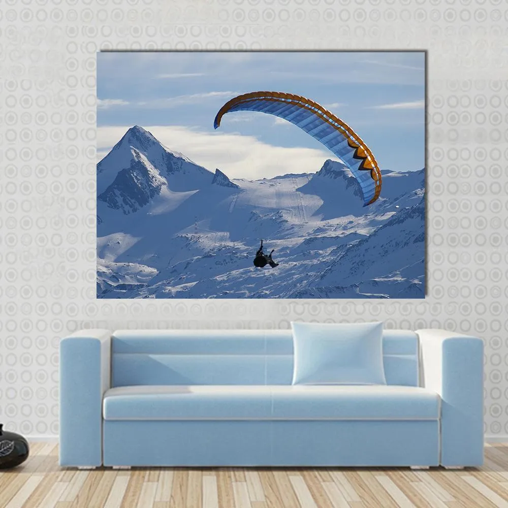 Paragliding Over Mountain In Winter Canvas Wall Art