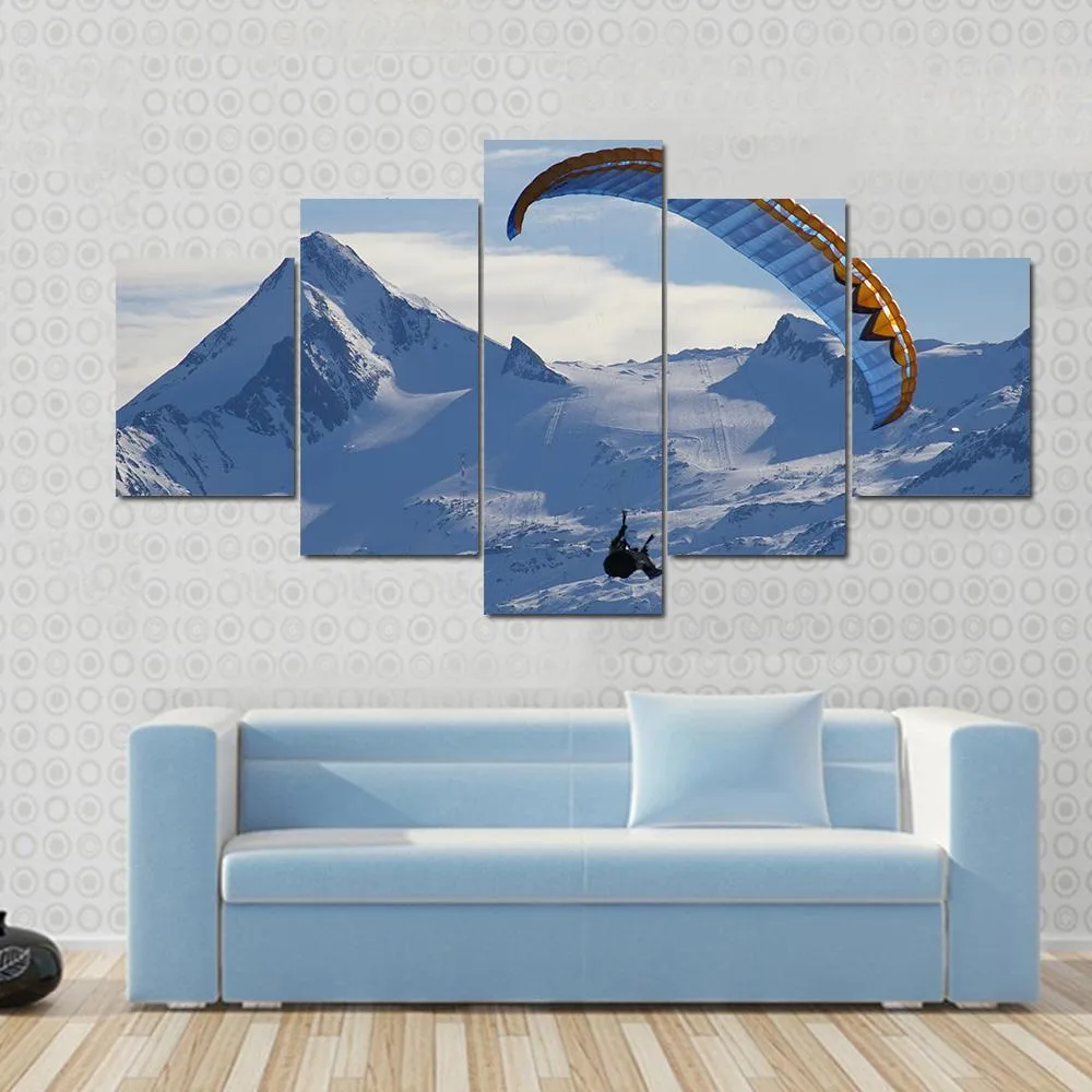 Paragliding Over Mountain In Winter Canvas Wall Art