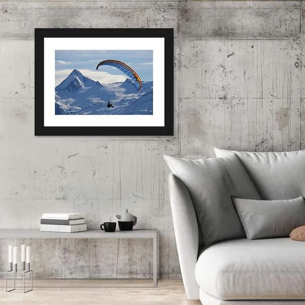 Paragliding Over Mountain In Winter Canvas Wall Art