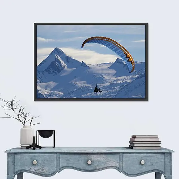 Paragliding Over Mountain In Winter Canvas Wall Art