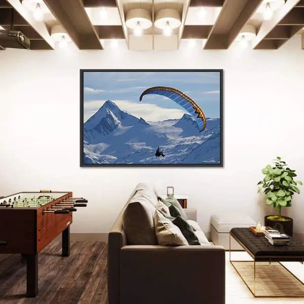 Paragliding Over Mountain In Winter Canvas Wall Art