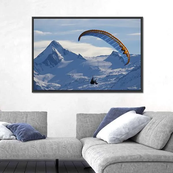 Paragliding Over Mountain In Winter Canvas Wall Art