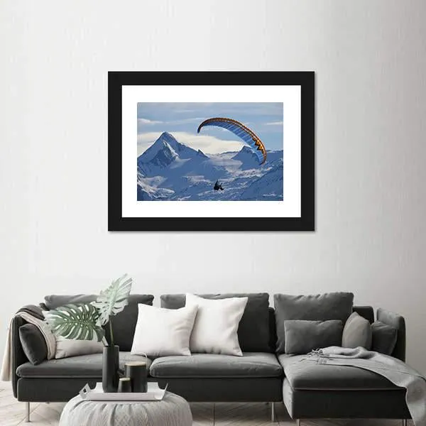 Paragliding Over Mountain In Winter Canvas Wall Art