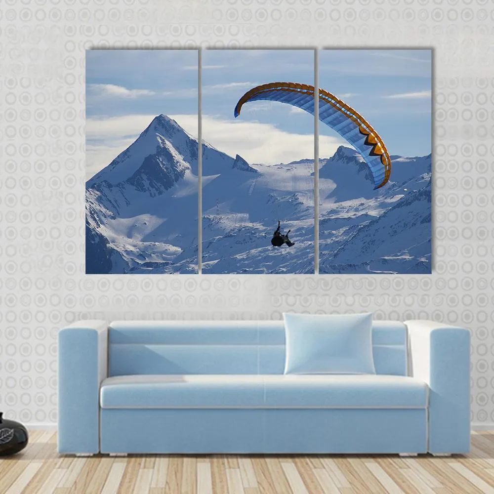 Paragliding Over Mountain In Winter Canvas Wall Art